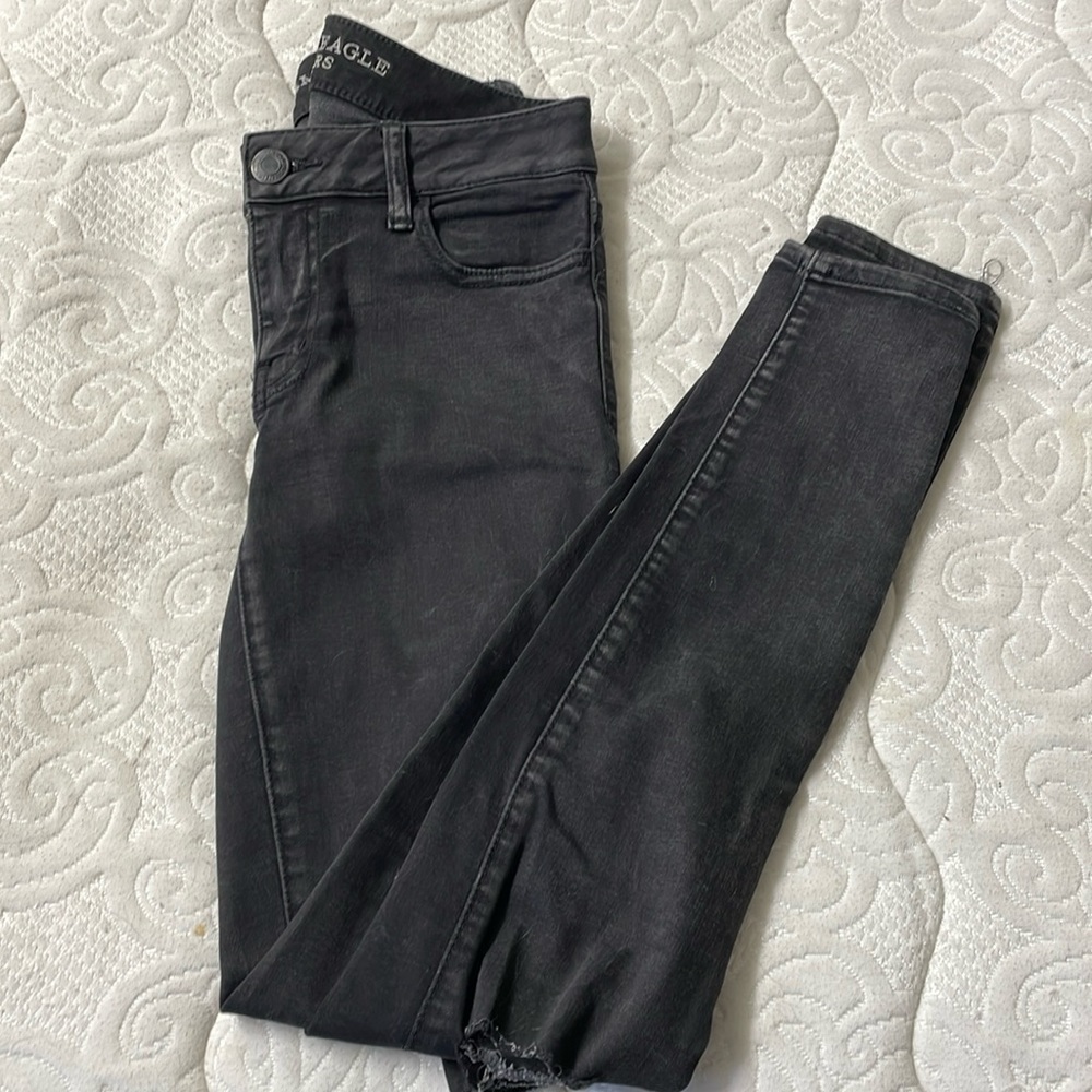 Ripped/distressed black skinny jeans